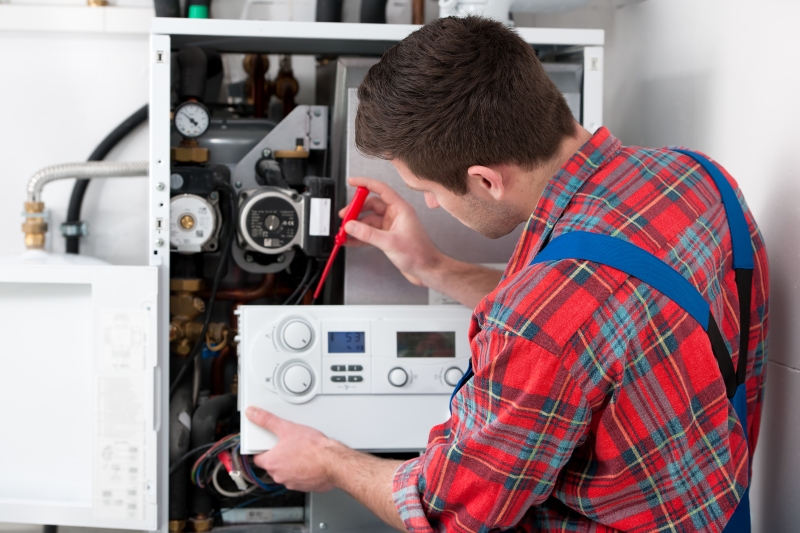 Gas Safe engineer working on a boiler in South Lambeth